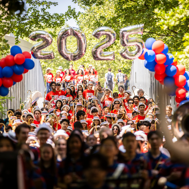 Penn Band and the class of 2025 walk down Locust walk celebrating becoming seniors