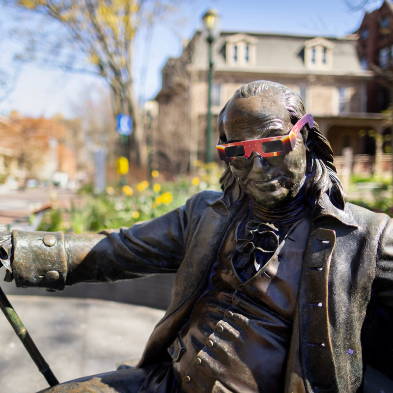 Ben on the Bench Statue wearing Solar Eclipse glasses
