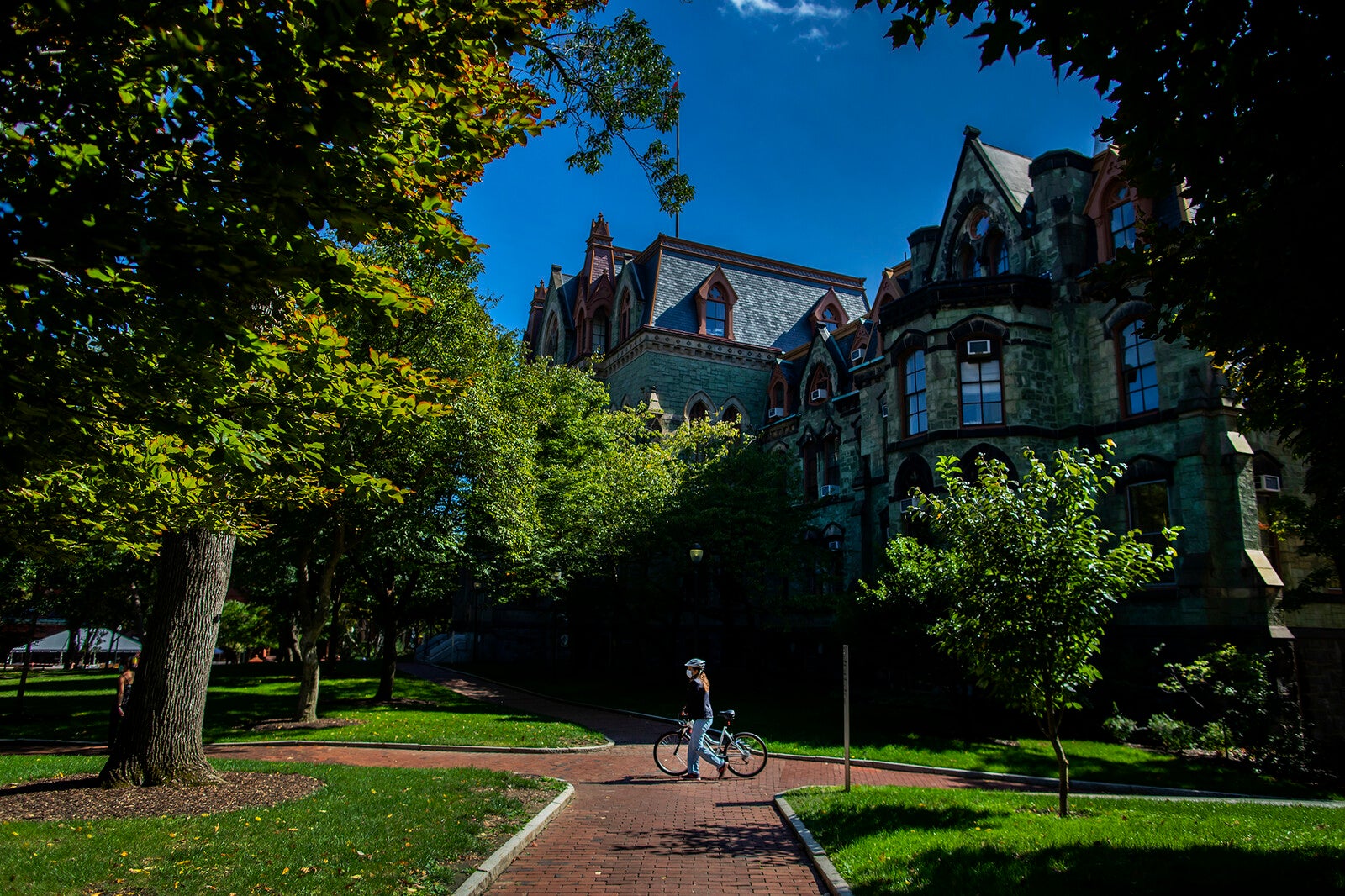 biker in front of college hall