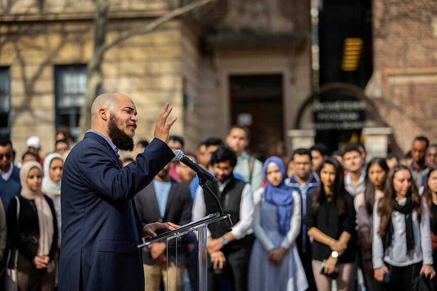 Rev. Charles Howard speaks to a diverse crowd of students on College Green