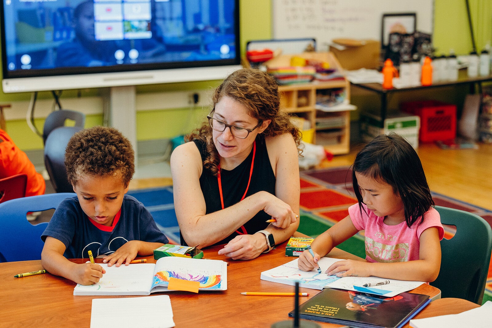 elementary school teacher with two students