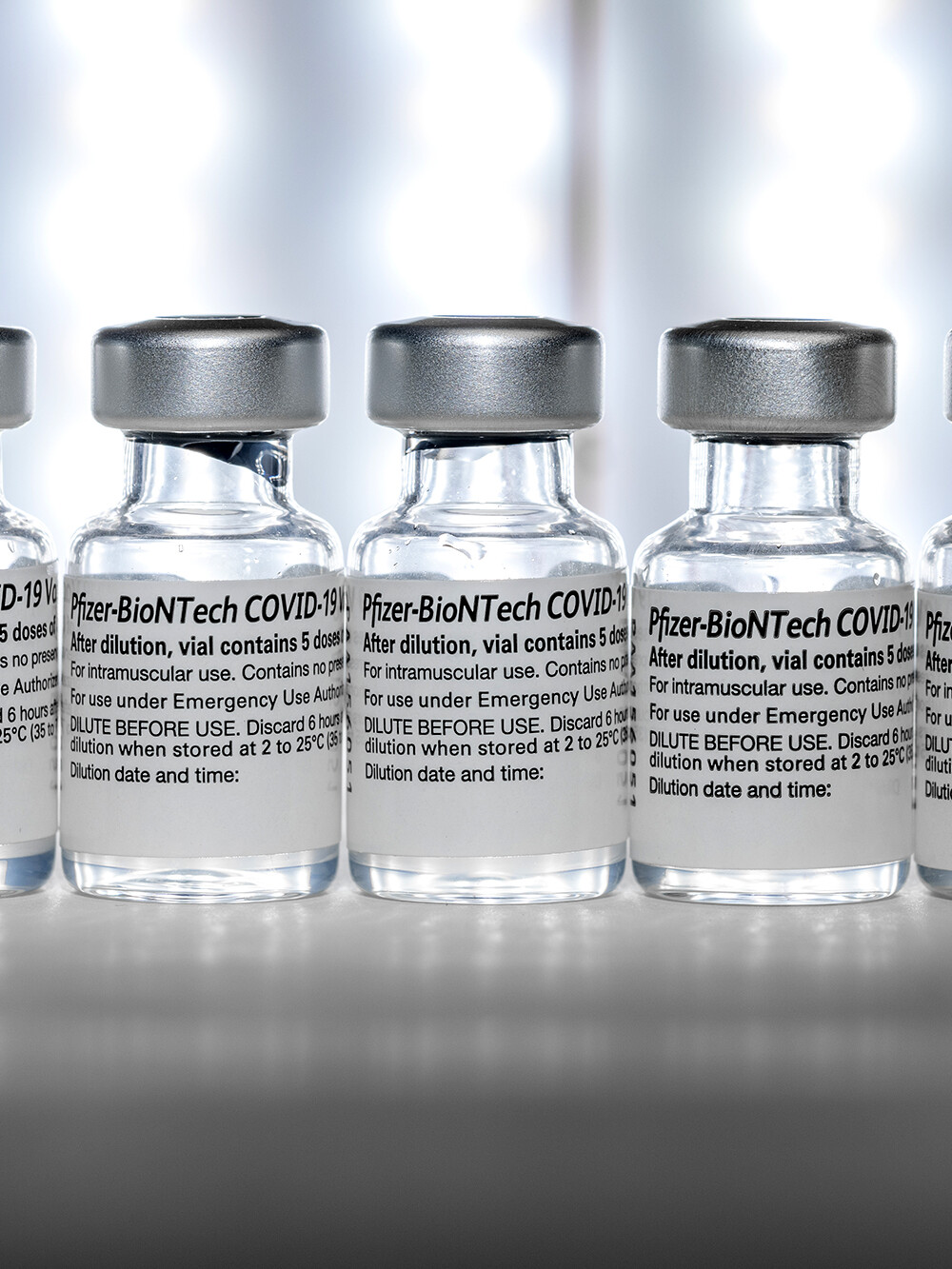 five vials of the covid vaccine