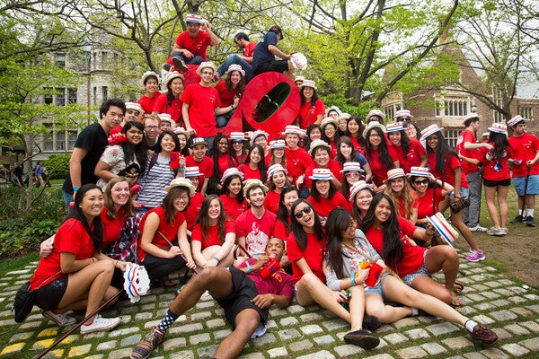 Students celebrating Hey Day in front of the campus LOVE statue