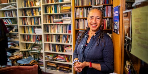 woman in front of bookcase