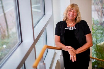 Diane Spats standing next to a window