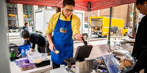 person making waffles