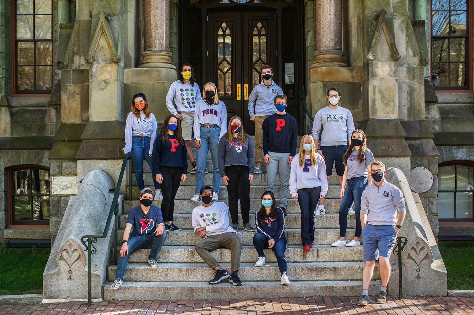 glee club and sirens on college hall steps