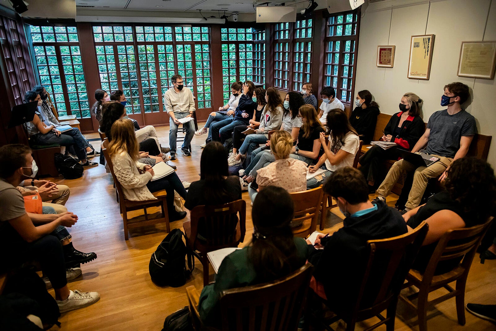 Al Filreis engaged in a discussion with students at a packed Kelly Writers House