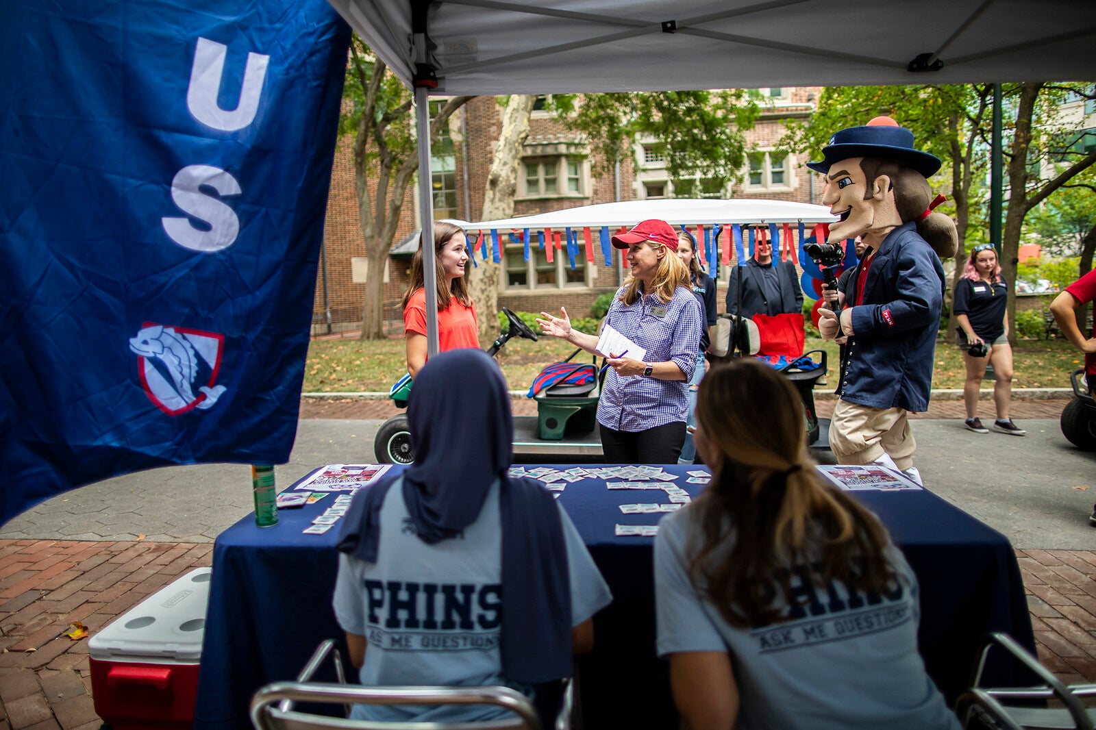 penn president liz magill interviews students on locust walk