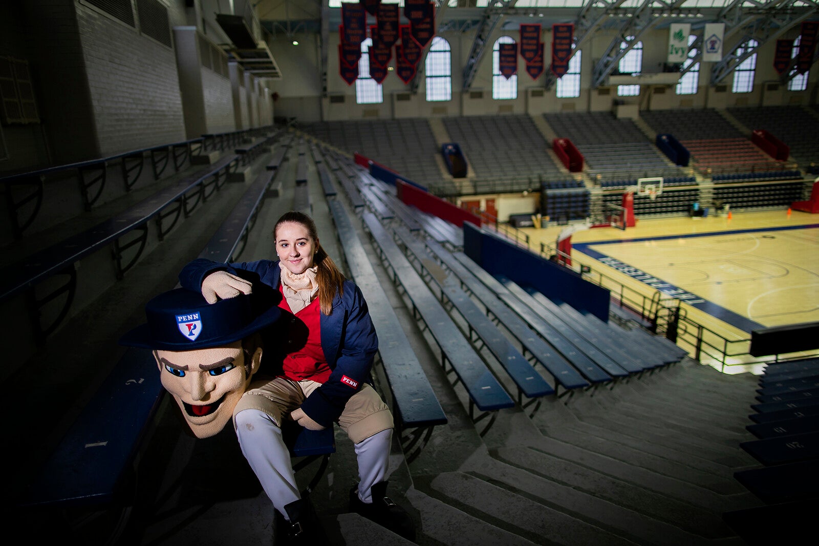 sophia, the penn quaker, sitting in the palestra