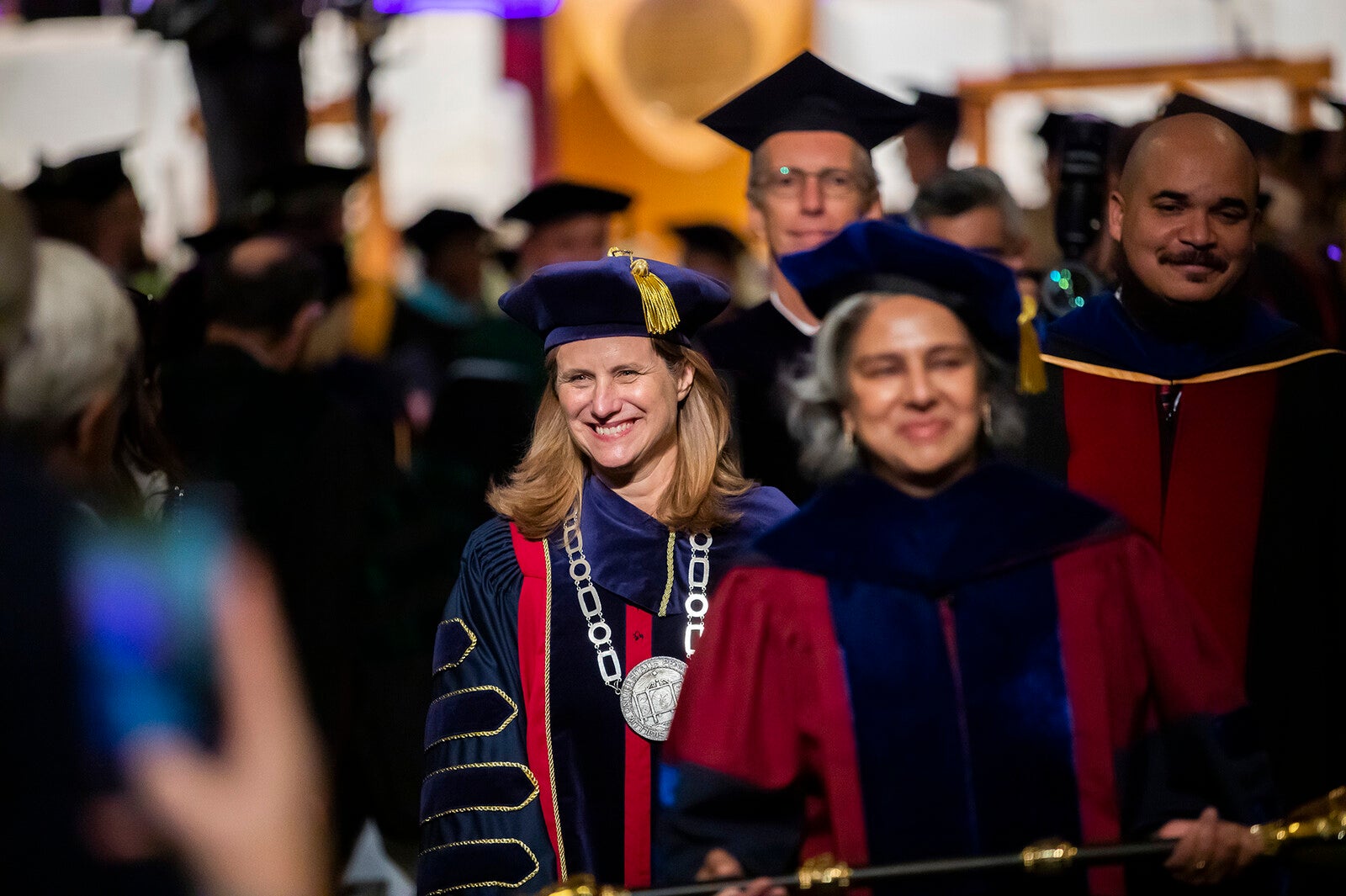 president magill processes down the aisle in irvine auditorium