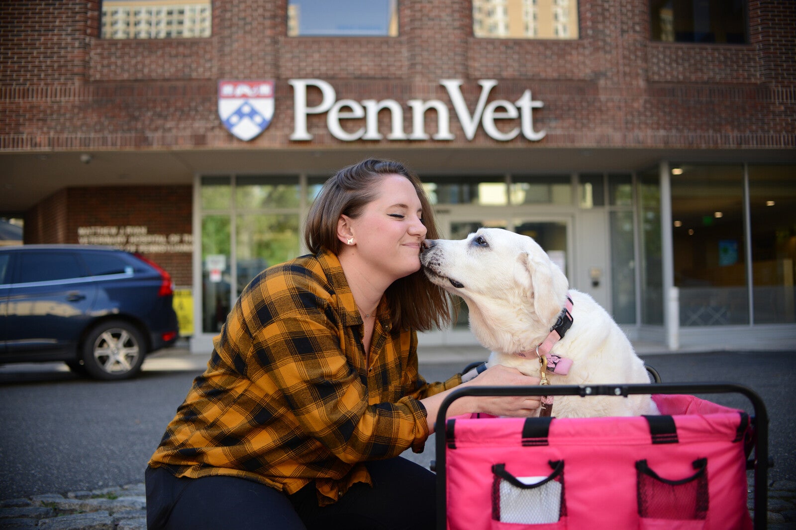 meg ruller with her dog maple outside penn vet