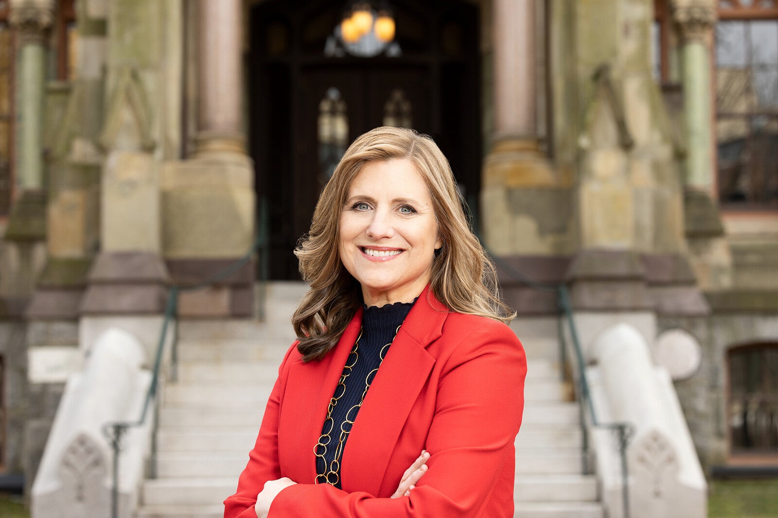 liz magill standing in front of college hall