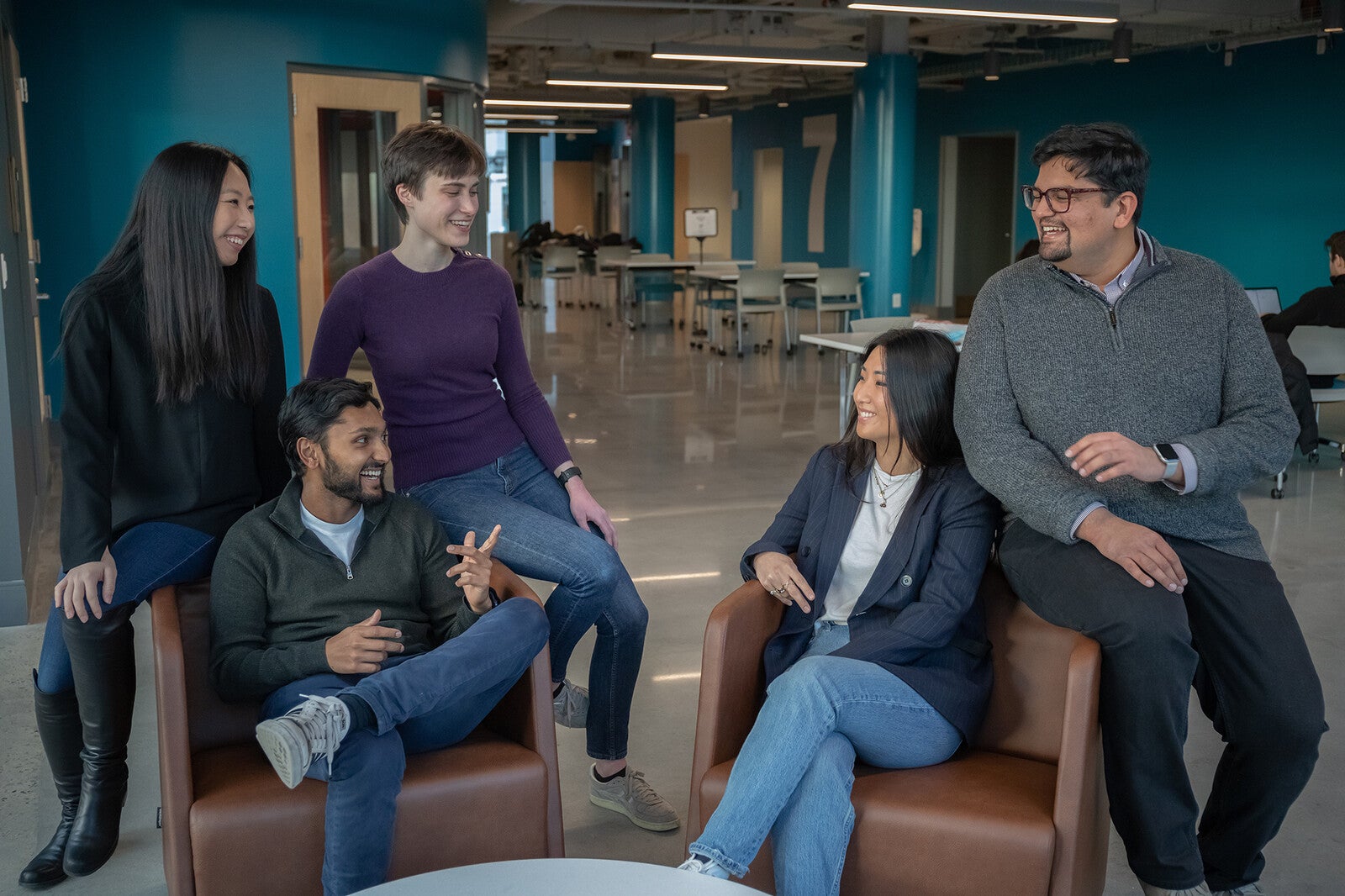 students gathering and talking in a lounge