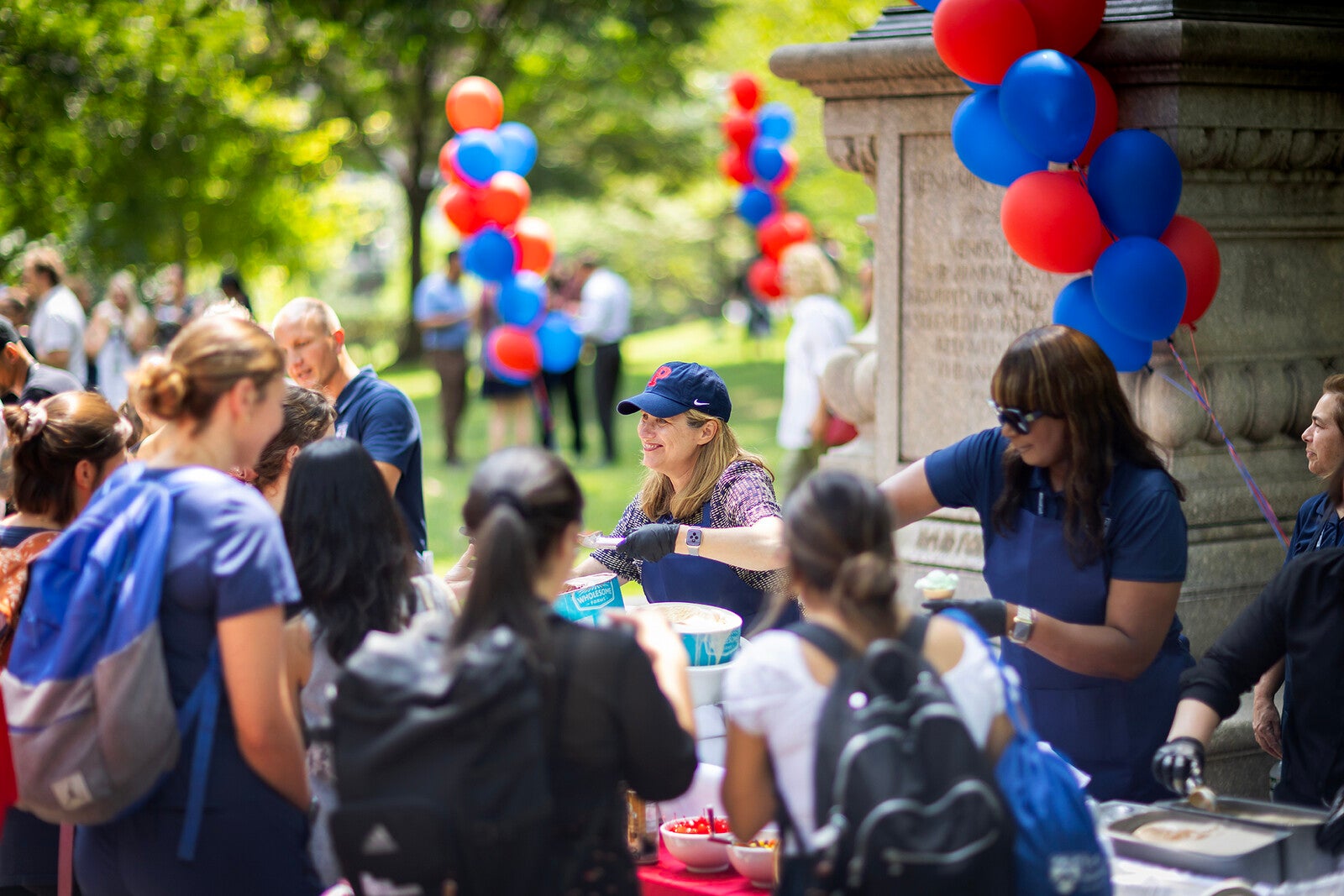 penn president liz magill serves ice cream on college green