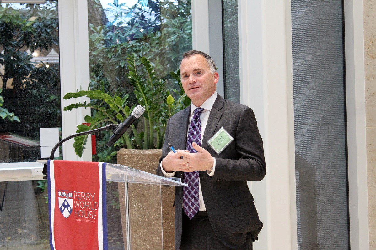 michael weisberg speaking at a podium