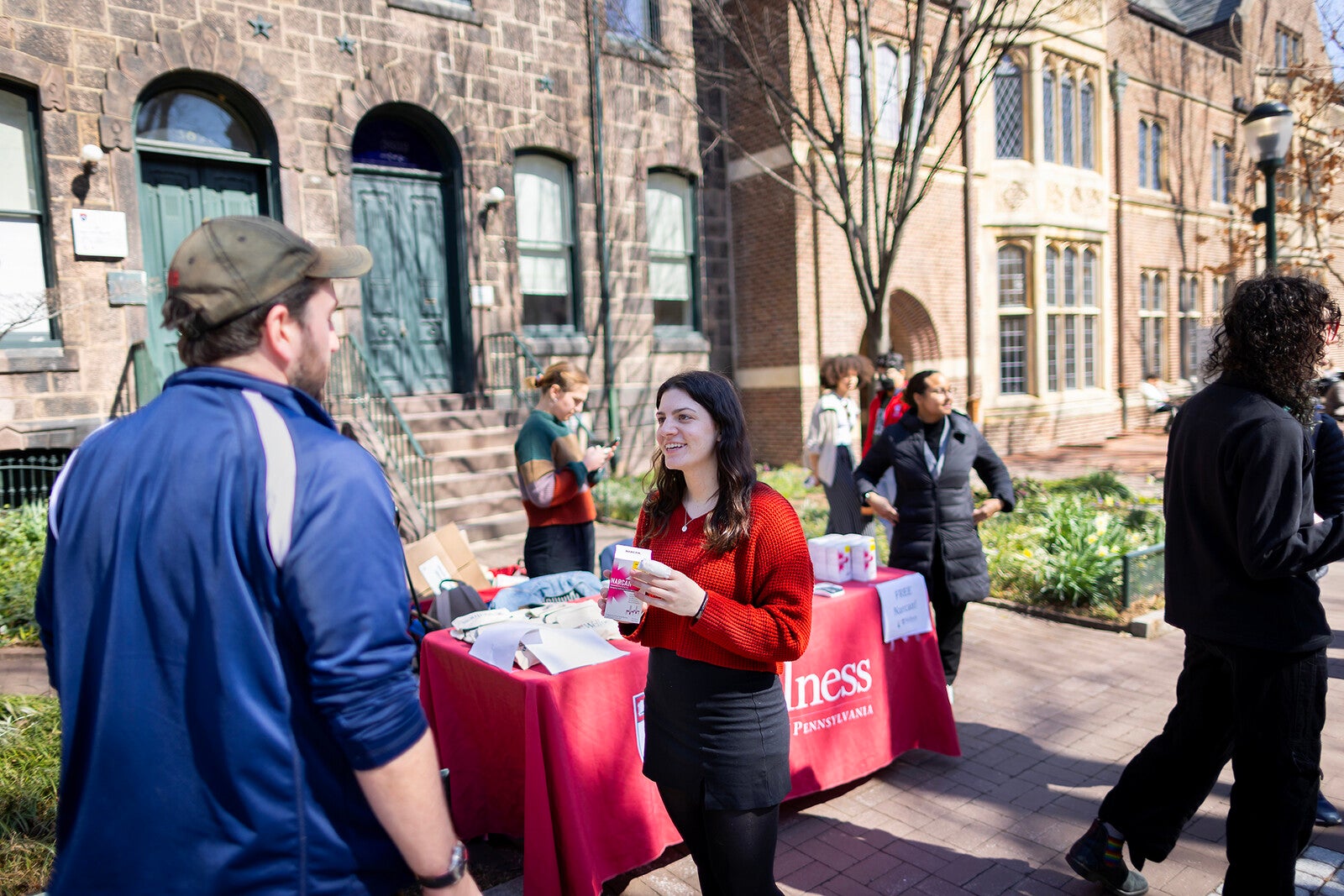 students handing out narcan on locust walk