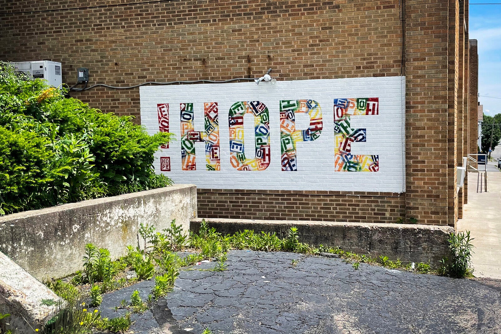 hazelton mural on brick wall, depicting hope