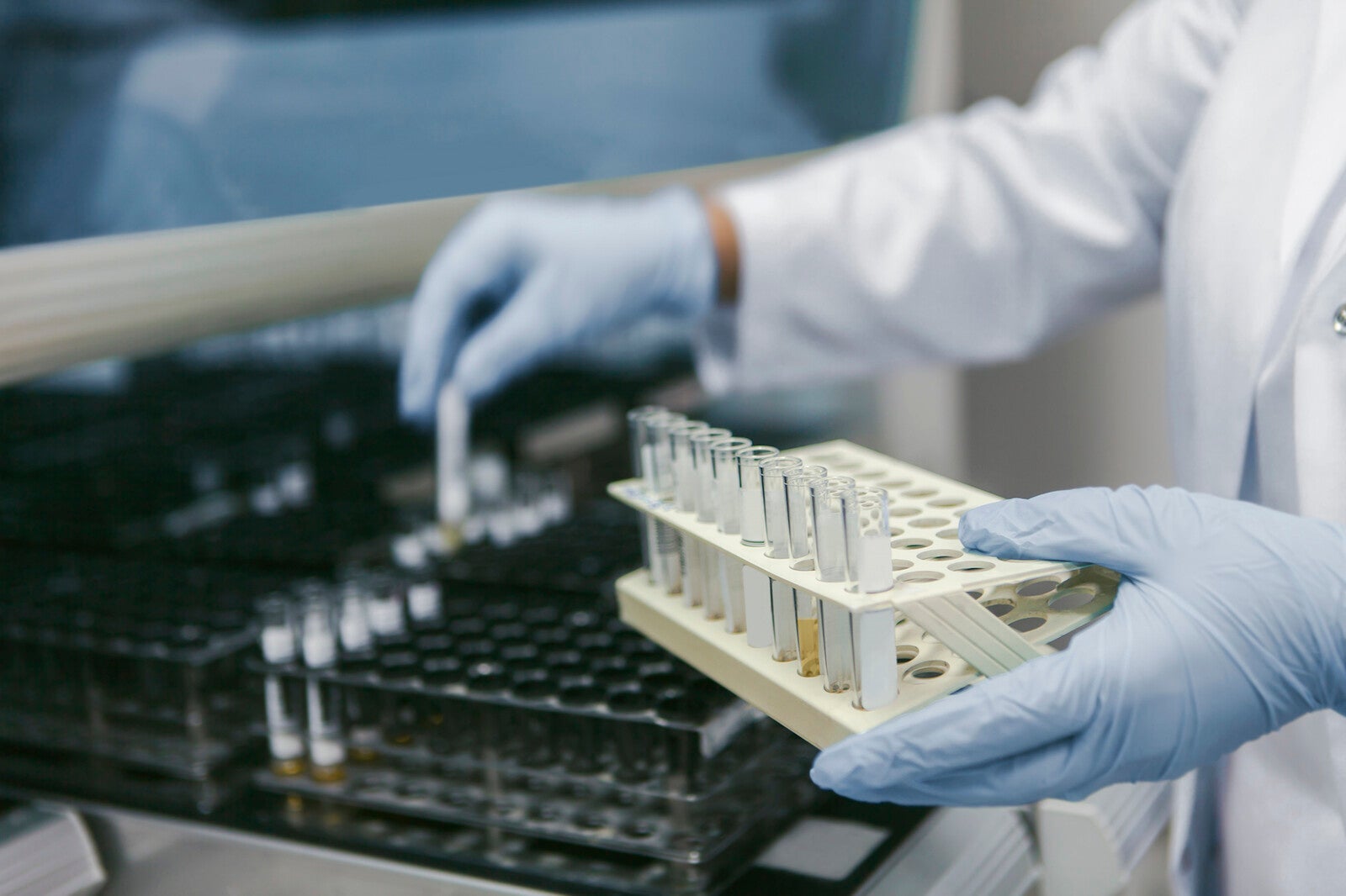lab tech with test tubes