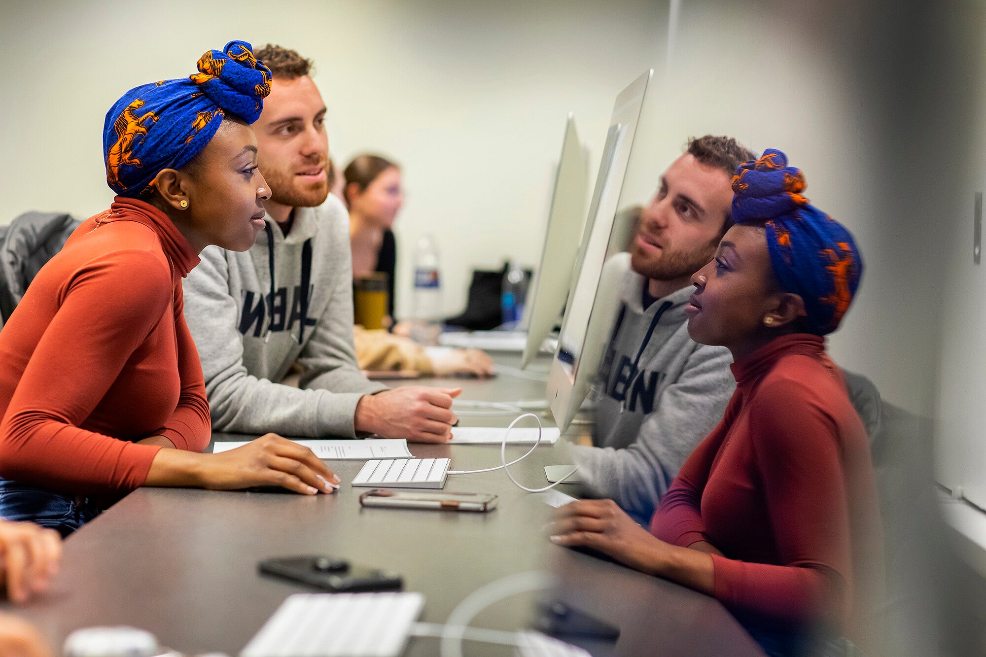 students editing video in jacksons hbo class