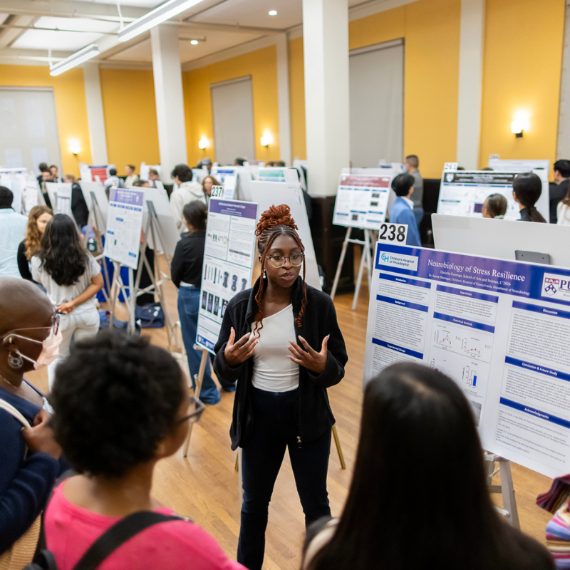 Student presenting their work at an exposition